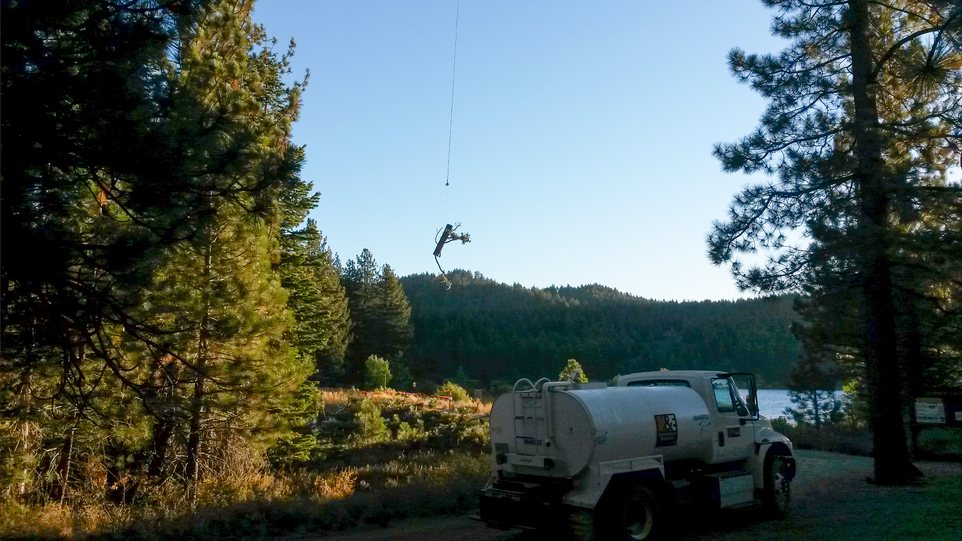 helicopter carrying off a log at Spooner Lake