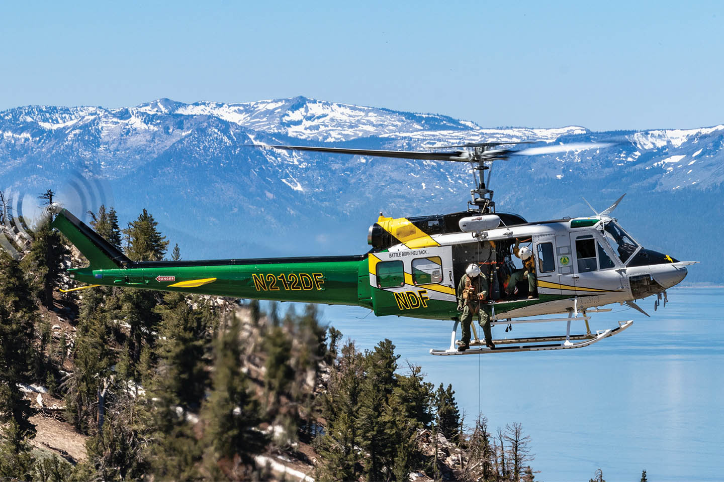 NDF helicopter flying over Lake Tahoe.
