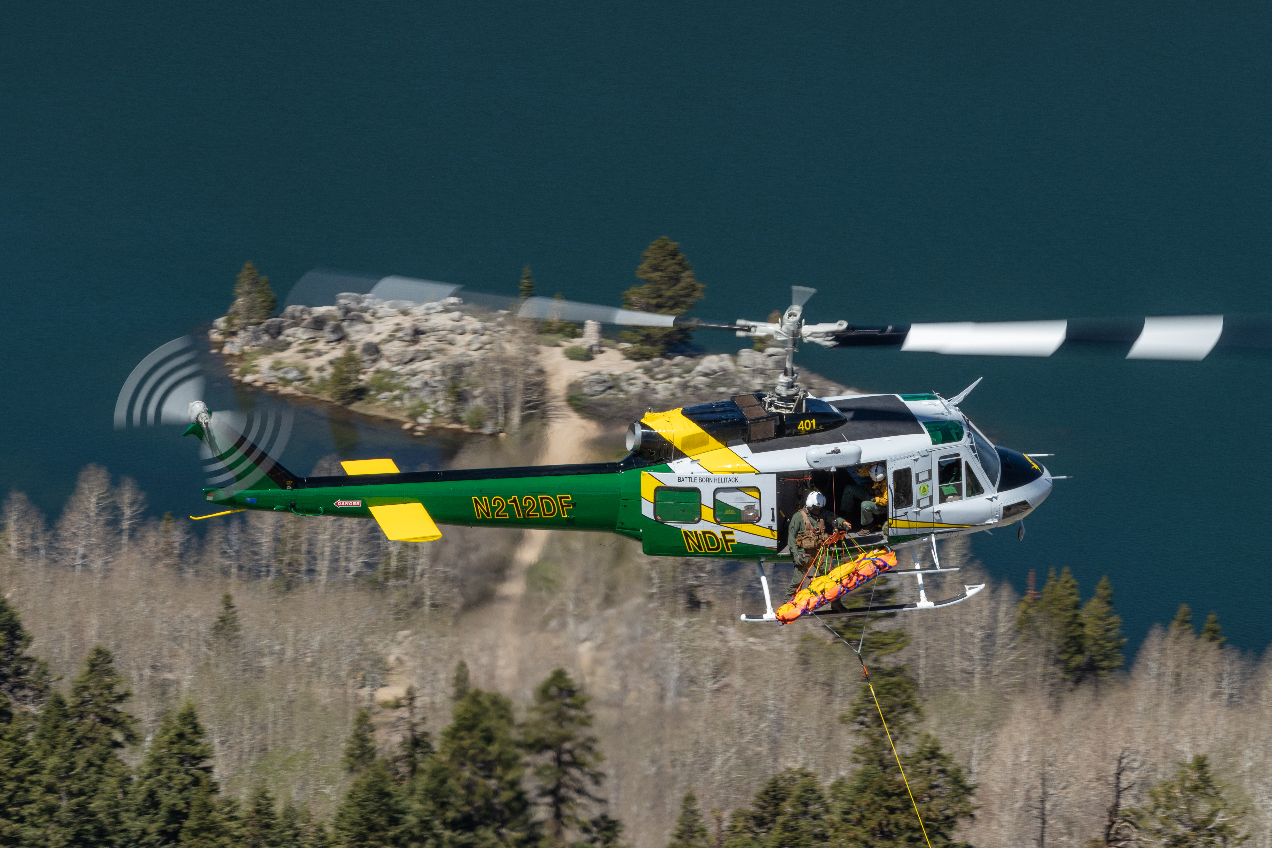 NDF helicopter flying over Lake Tahoe.